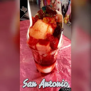 an ice cream sundae with fruit topping