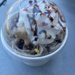 an ice cream sundae with sprinkles