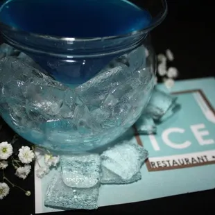 a blue drink in a glass