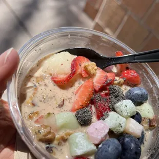 Classic rice, strawberries, blueberries, mochi, black sesame powder in