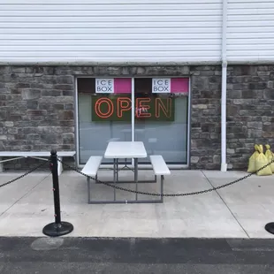a table with a sign that says open