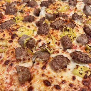 Sausage and banana pepper pizza light sauce light cheese and well done, excellent!