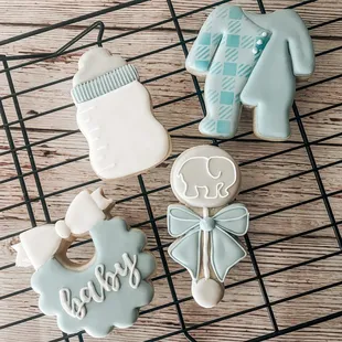 baby shower cookies on a cooling rack