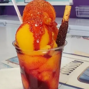 a cup of ice cream and fruit