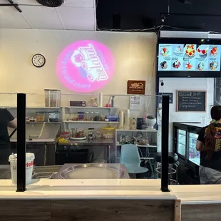 a man standing behind a counter