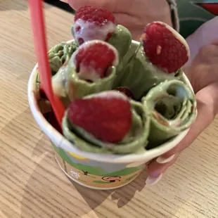 Green tea with raspberry mix-in and topping... Very refreshing