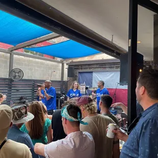 a group of people standing in front of a stage