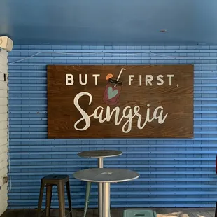 a sign that says, but first sangeria