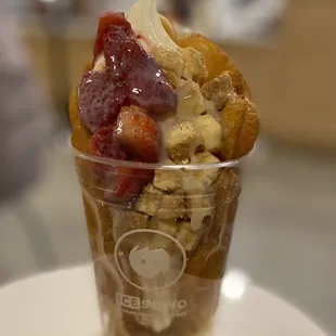 an ice cream sundae with strawberries and bananas