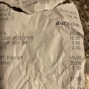 Pictures of crumbled up ticket Kellie tried to hide from me. I gave her a $50.00 bill and was waiting for my change.