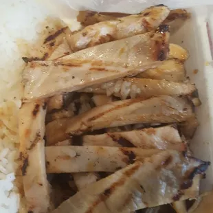 a close up of a meal in a styrofoam container