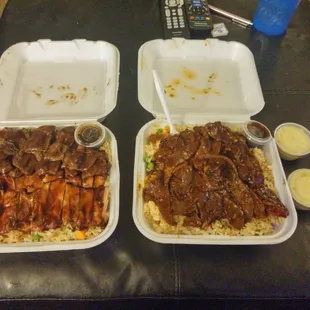 The hubby&apos;s chicken and beef combo w/fried rice on the left and my spicy beef w/fried rice on the right w/crack dressing to the right.
