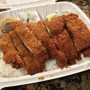 Chicken katsu and California roll with rice.