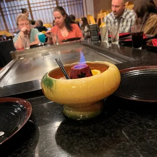 a bowl of food with chopsticks in it