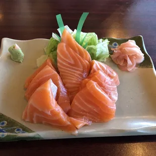 three pieces of salmon on a plate