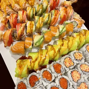 a platter of sushi and rolls