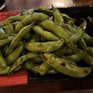 a close up of a plate of green beans