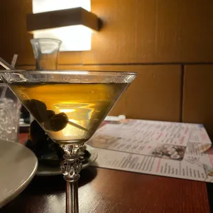 a martini with olives in it