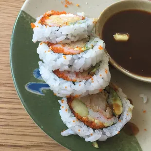 a plate of sushi rolls