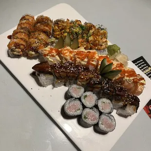 Top left: Jim Roll, top right: Volcano Roll, top middle: Ichiban Roll, bottom middle: Caterpillar Roll, bottom: Yellowtail Roll.