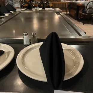 two plates with napkins on them
