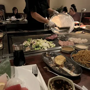 a man preparing food in a restaurant