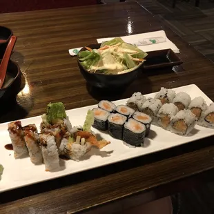 a plate of sushi and a bowl of soup