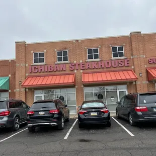 cars parked in front of the restaurant