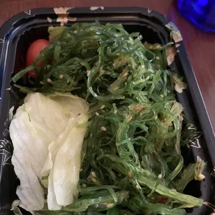 Seaweed salad with yellowed iceberg lettuce