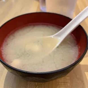 a bowl of soup with a spoon