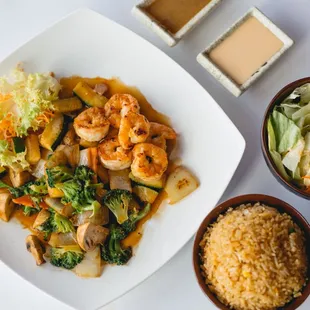 a plate of food and a bowl of rice