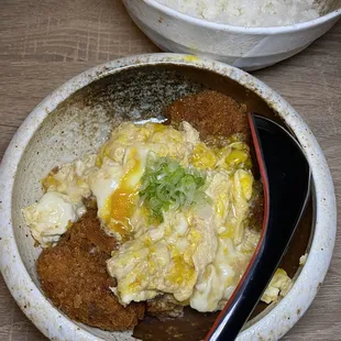 a bowl of rice and a bowl of chicken