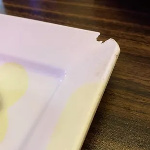 Dirty plate with broken edge for the sushi