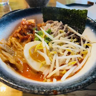 a bowl of ramen with a hard boiled egg