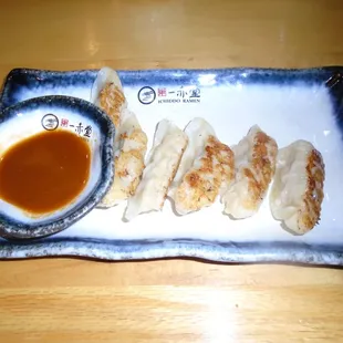 Gyoza with dipping sauce (pork dumplings).