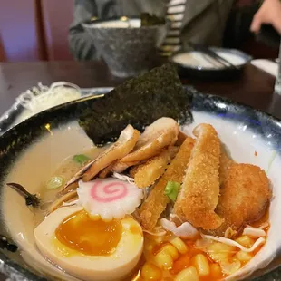a bowl of ramen and a boiled egg