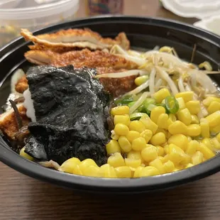 a bowl of ramen and corn