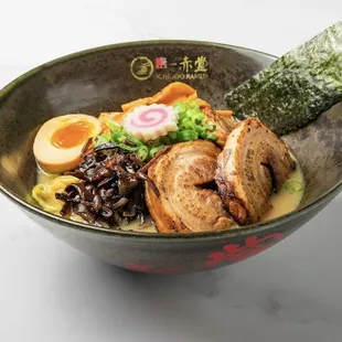 Char siu ramen 
roasted pork belly, fish cake, half cooked egg, bamboo shoot, black fungus, Green onion, black oil in soy base.