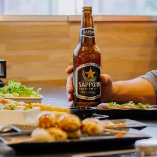 a man holding a beer