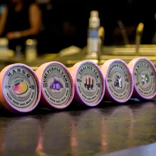 a row of pink cans