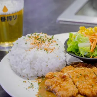 a bowl of rice and a salad