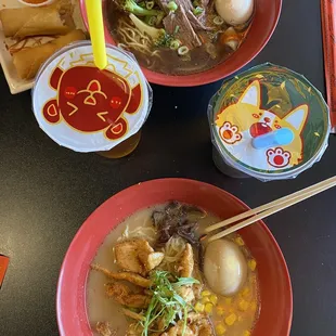 GYUNIKU RAMEN with SPRING ROLL (2pc.) on top &amp; GRILLED CHICKEN RAMEN on bottom with bubble teas in the middle