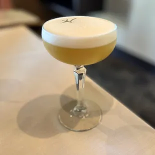 a cocktail in a coupe glass
