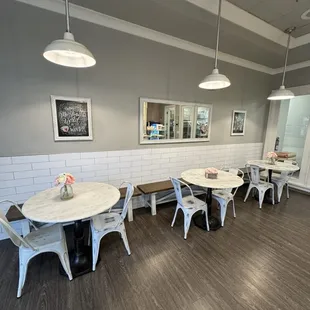 a dining area with tables and chairs