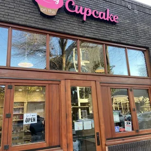 Picking up cupcakes for birthday boy.