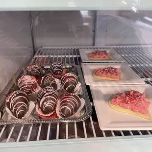 Chocolate covered strawberries and heart cookies for Valentine's Day.
