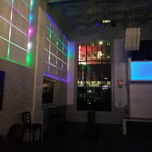 a view of a bar with neon lights