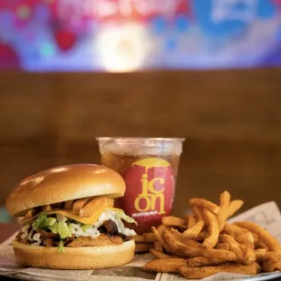 a burger and french fries on a table