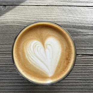 a cup of coffee with a heart drawn in it