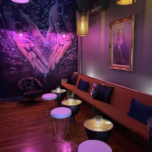 a living room with a couch, tables, and lamps